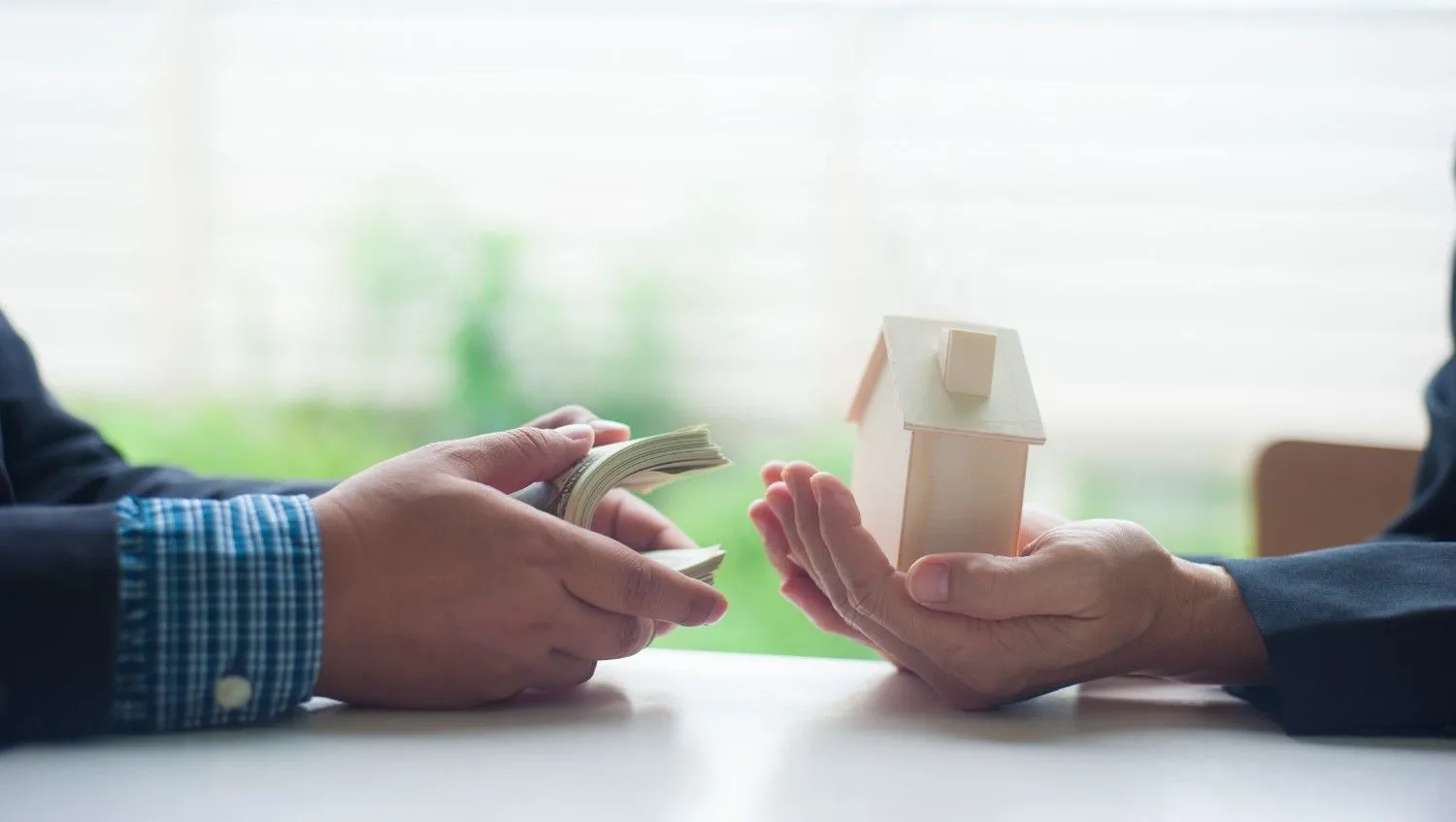 Keys to a sold home being handed over